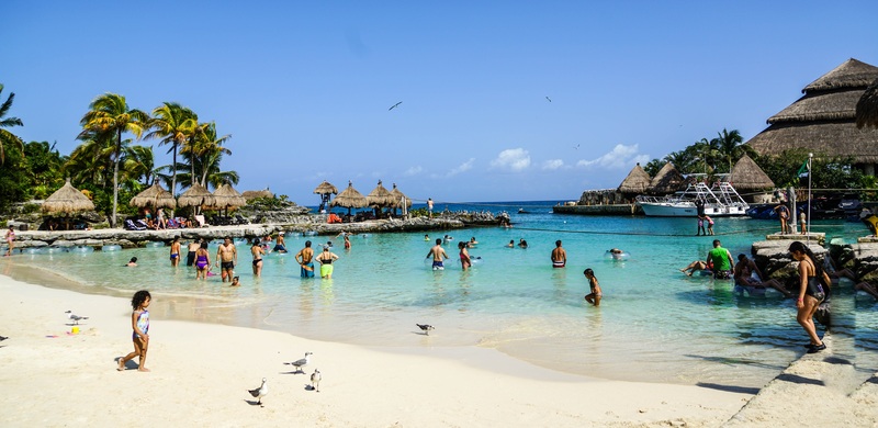 people enjoying the water at costa maya beaches