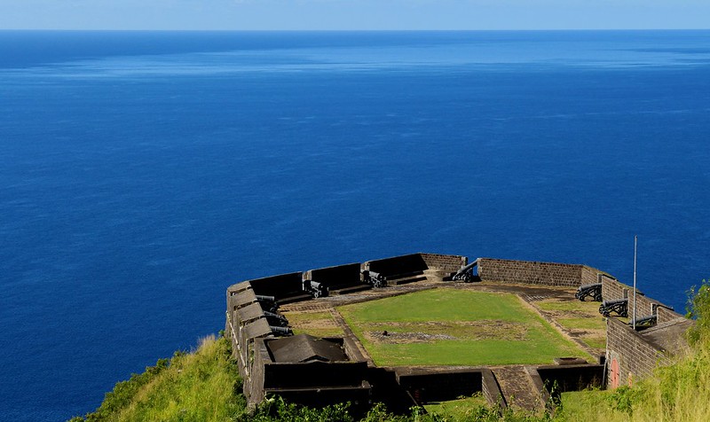 View of Brimstone Hill Fortress National Park and cannons behind a wall that used to be used in defense of sea-attacks.