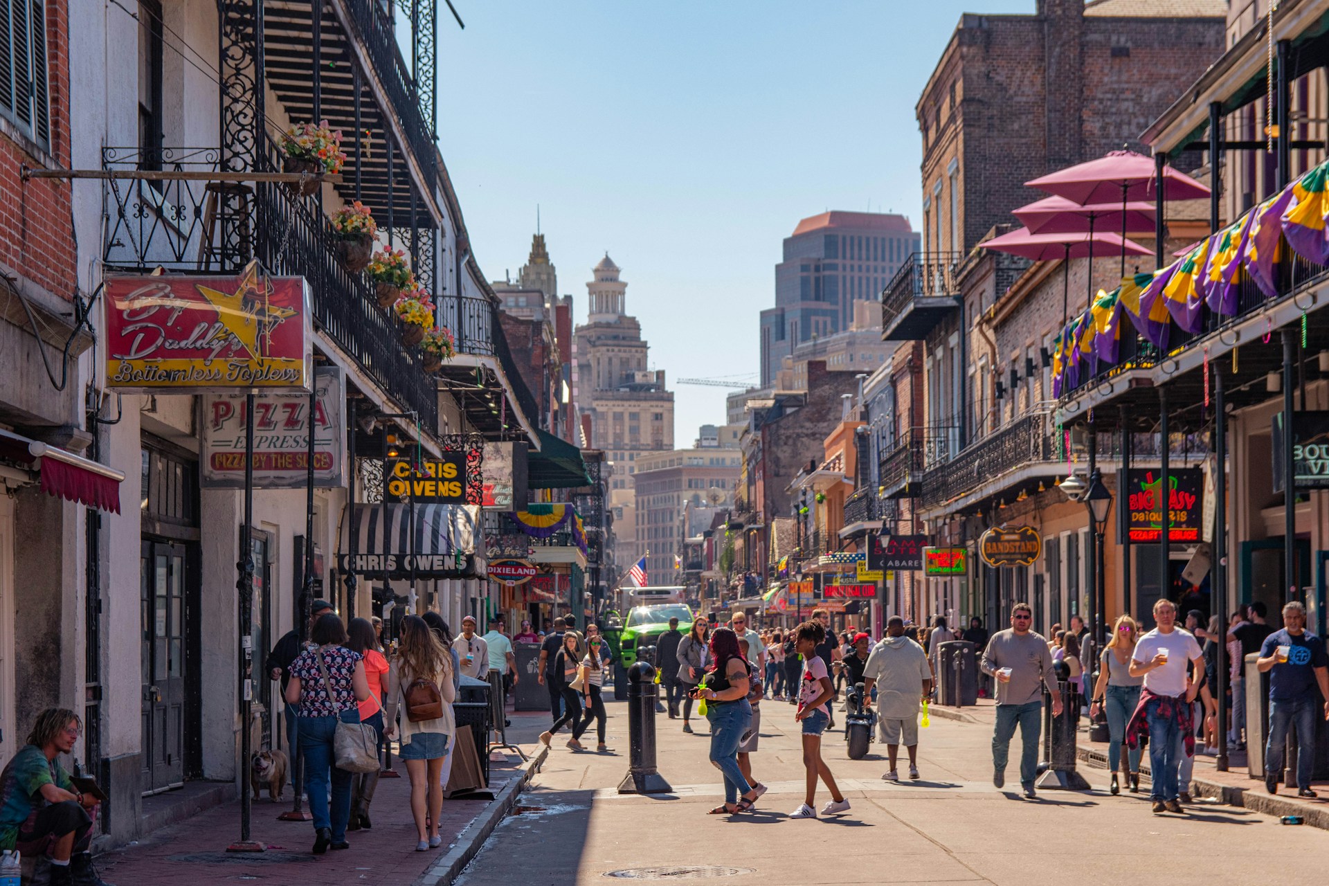 view of the crowded city of new orleans from bourbon street.