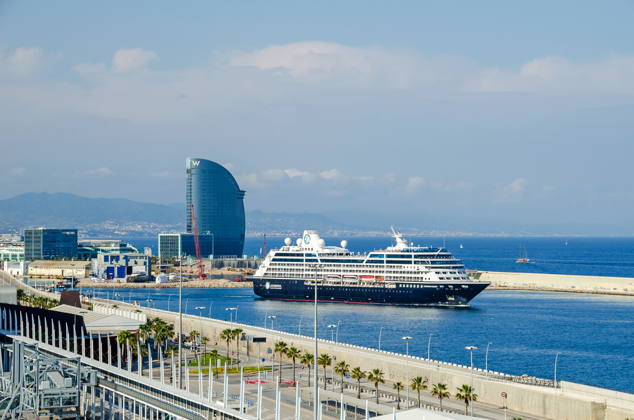 View of port Vell and its cruise terminal with cruise-liner Azamara and W Barcelona, also known as the Hotel Vela