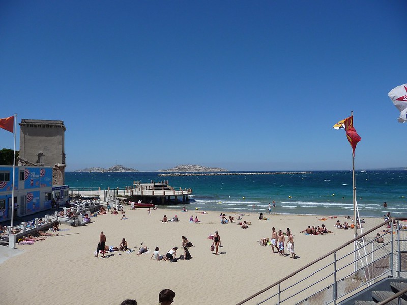 view of people enjoying the beach in Marseille, France.