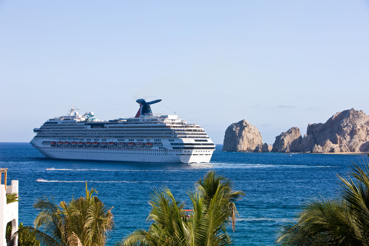 Cruise Ship Carnival Splendor Leaving Cabo San Lucas. Lands End is visible which is the edge of the Pacific Ocean and Sea of Cortez