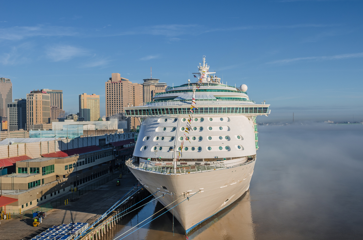 Cruise ship docked at Port of New Orleans. Morning mist is seen on Mississippi River.