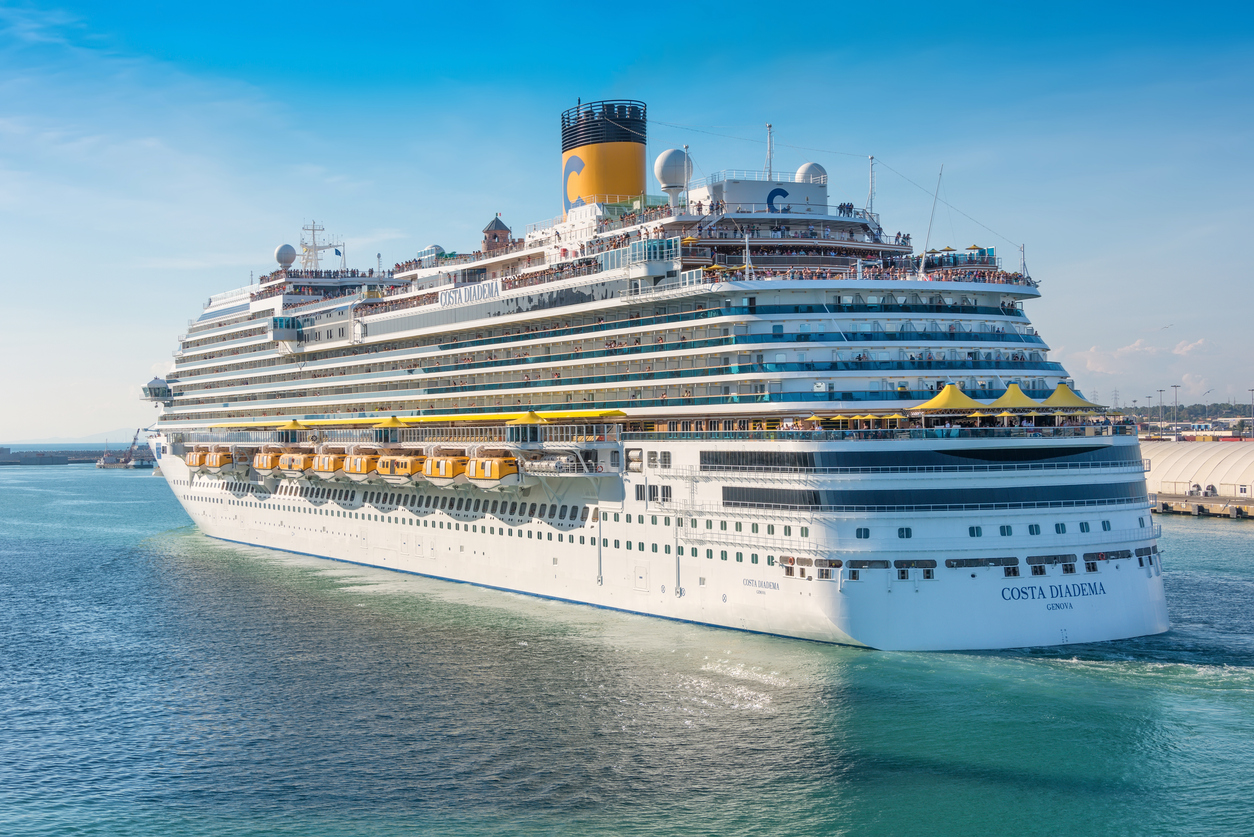 Passengers aboard the Costa Diadema cruise ship gather on deck for the departure from the port of Rome, Italy.