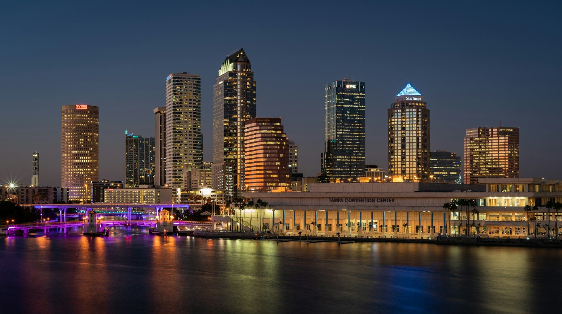 view of the city on the water in Tampa, Florida. Beautiful big lit up buildings.