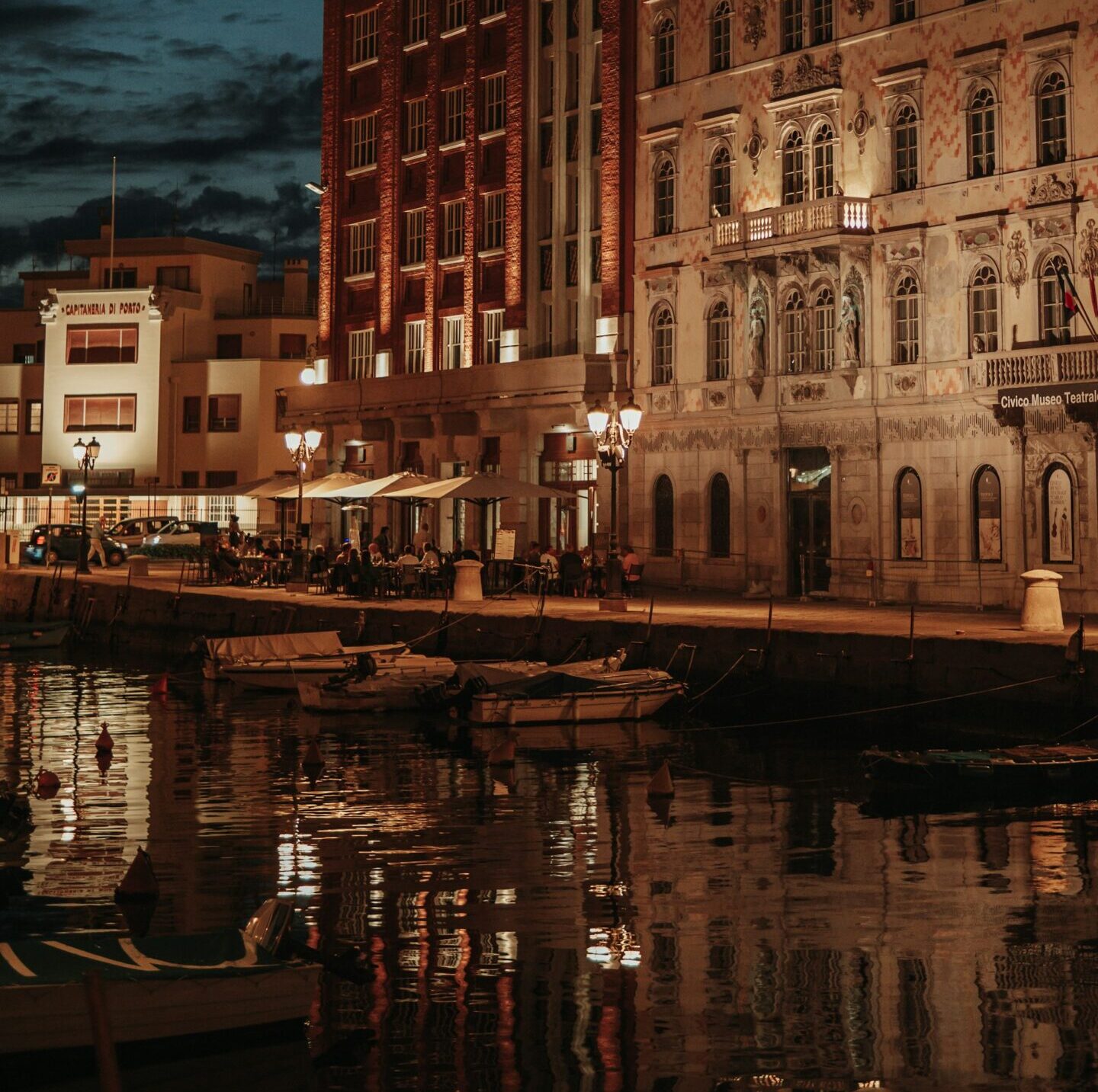 views of the boardwalk on the water in Trieste, Italy