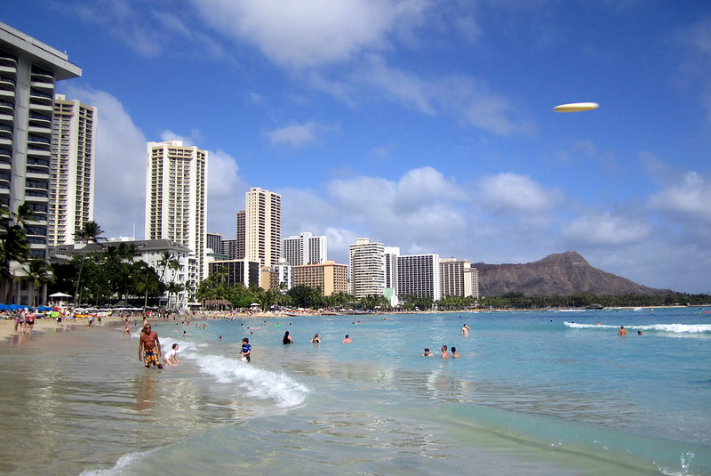 people enjoying the water at Waikiki beach in Honolulu Hawaii 