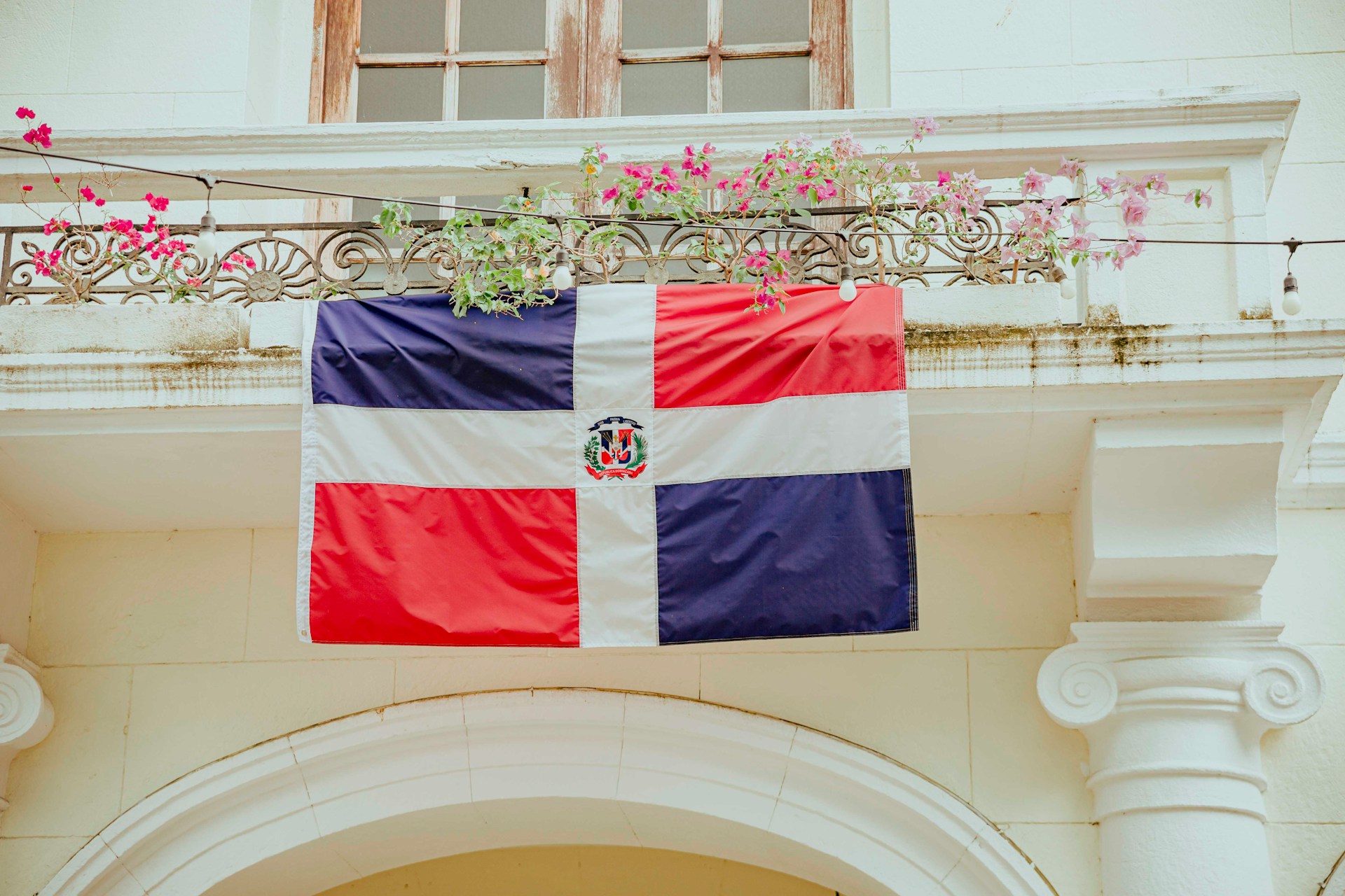 The Dominican Republic flag hanging from a building