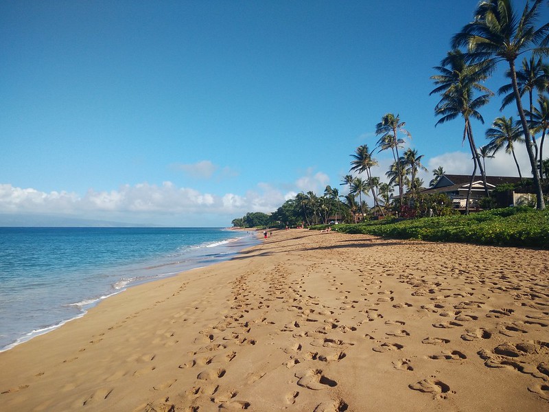 footsteps in the sand in Kaanapali beach, Maui, Hawaii