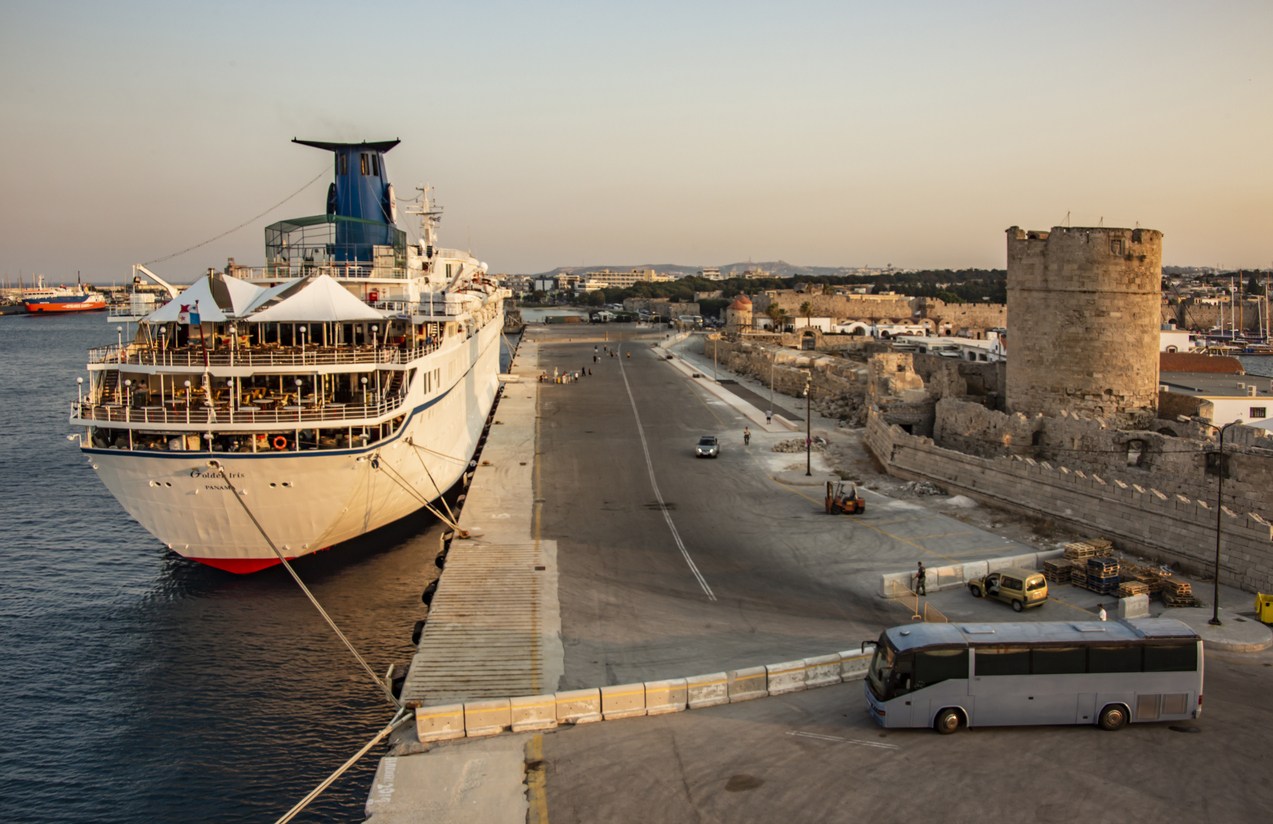 ship at the port of rhodes, bus for tourists and rhodes castle