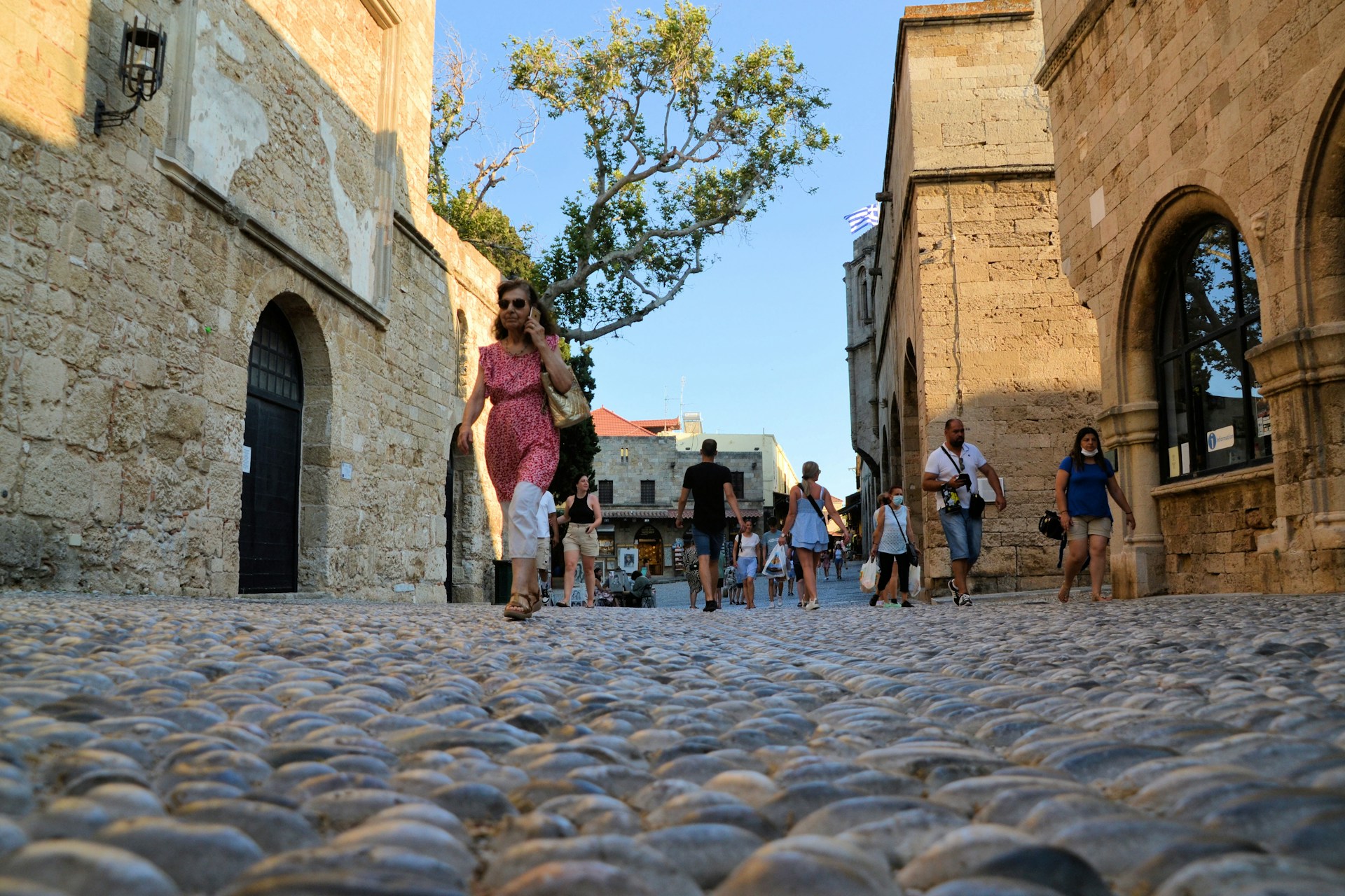 people walking through the street in Old Town, Rhodes, Greece